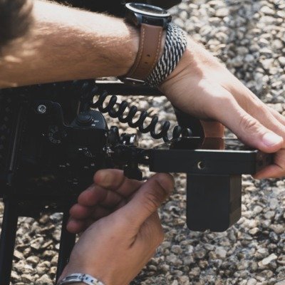 a man is holding a gun in his hand
